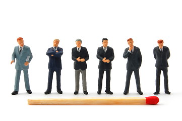 Image showing business man and matches on white