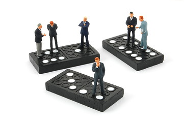 Image showing business man on domino isolated