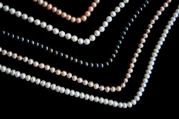 Image showing White, black and pink pearls on the black silk 