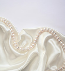 Image showing Smooth elegant white silk with pearls as wedding background 