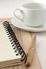 Image showing Notebook and coffee cup