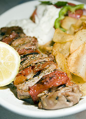 Image showing pork souvlaki with tzatziki taverna food Greece