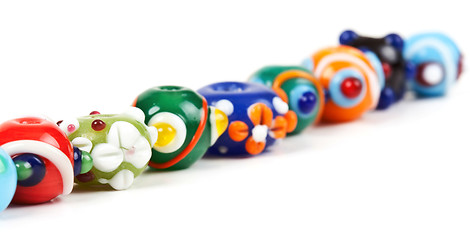 Image showing colored glass beads hand
