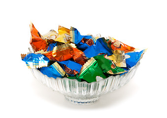 Image showing glass vase with candy in colorful wrappers