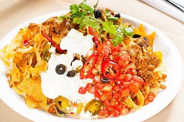 Image showing fresh nachos and vegetable salad with meat