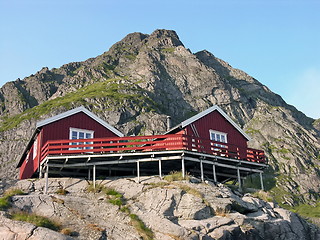 Image showing Two wooden red cottage on the mountain