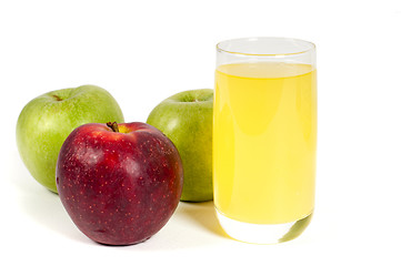Image showing Glass of juice and apples