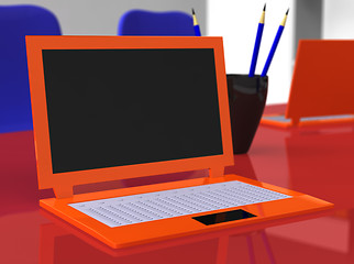 Image showing Laptop on red table with blue pencils