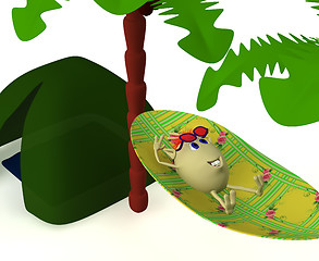 Image showing Puppet resting near green tent under palm