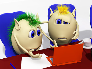 Image showing Two puppets looking at laptop with sorrow