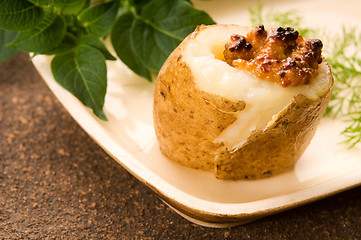 Image showing Baked potato with sour cream, grain Dijon mustard and herbs