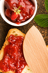 Image showing Wild strawberry jam with toast