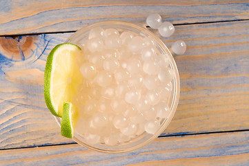 Image showing tapioca pearls with lime. white bubble tea ingredients