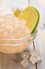 Image showing tapioca pearls with lime. white bubble tea ingredients