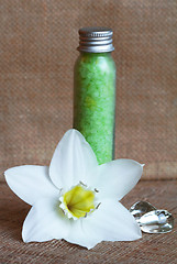 Image showing Bottles of sea salt and white flower