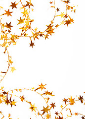 Image showing Holiday golden stars and spangles as background 