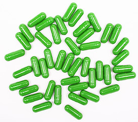 Image showing Green pills on white background 