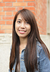 Image showing young woman smiling friendly