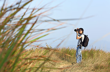 Image showing Photographer taking photo outdoor