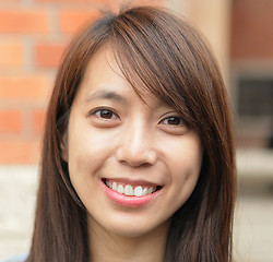 Image showing young woman smiling friendly 