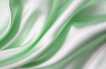Image showing Smooth elegant green silk as background