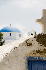 Image showing ancient Greek Island church with cross blue dome church backgrou