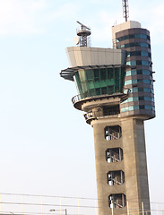 Image showing air traffic control tower at an airport on a stormy looking day.