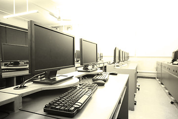 Image showing workplace room with computers in row 