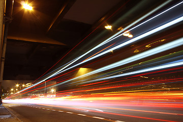 Image showing Fast moving cars at night 