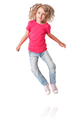 Image showing Happy jumping girl with heels together
