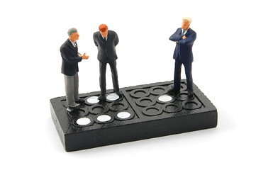 Image showing business man on domino isolated