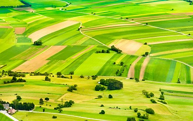 Image showing aerial view of green fields and slopes