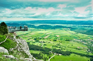 Image showing Lookout point with green fields and mountains