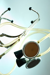 Image showing stethoscope on a glass with reflection
