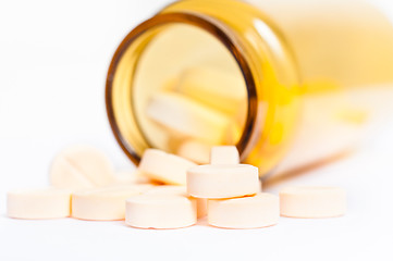 Image showing Pills with bottle on isolated white background