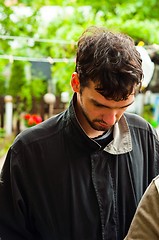 Image showing Depressed man with green blurry background