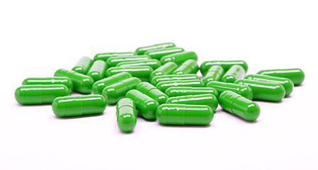 Image showing Green pills on white background 