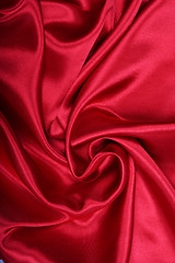 Image showing Smooth elegant red silk as background 