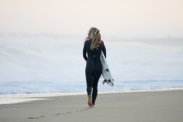 Image showing Attractive surfer in the dawn