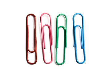 Image showing Four multicolored paperclips