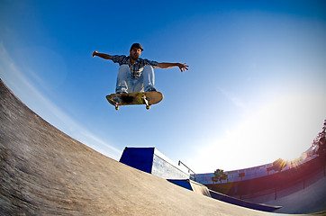 Image showing Skateboarder flying