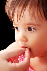 Image showing Cute little baby eat food 