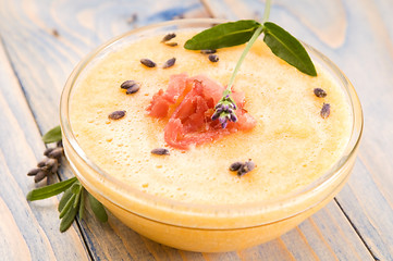 Image showing fresh melon soup with parma ham and lavender flower