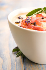 Image showing fresh melon soup with parma ham and lavender flower