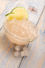 Image showing tapioca pearls with lime. white bubble tea ingredients