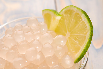 Image showing tapioca pearls with lime. white bubble tea ingredients