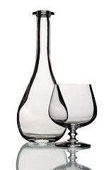 Image showing Glass bottle and goblet, isolated.