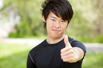 Image showing Portrait of a man showing thumbs-up sign