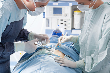 Image showing Medical experts carrying on surgical operation