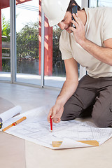 Image showing Architect working on blueprint